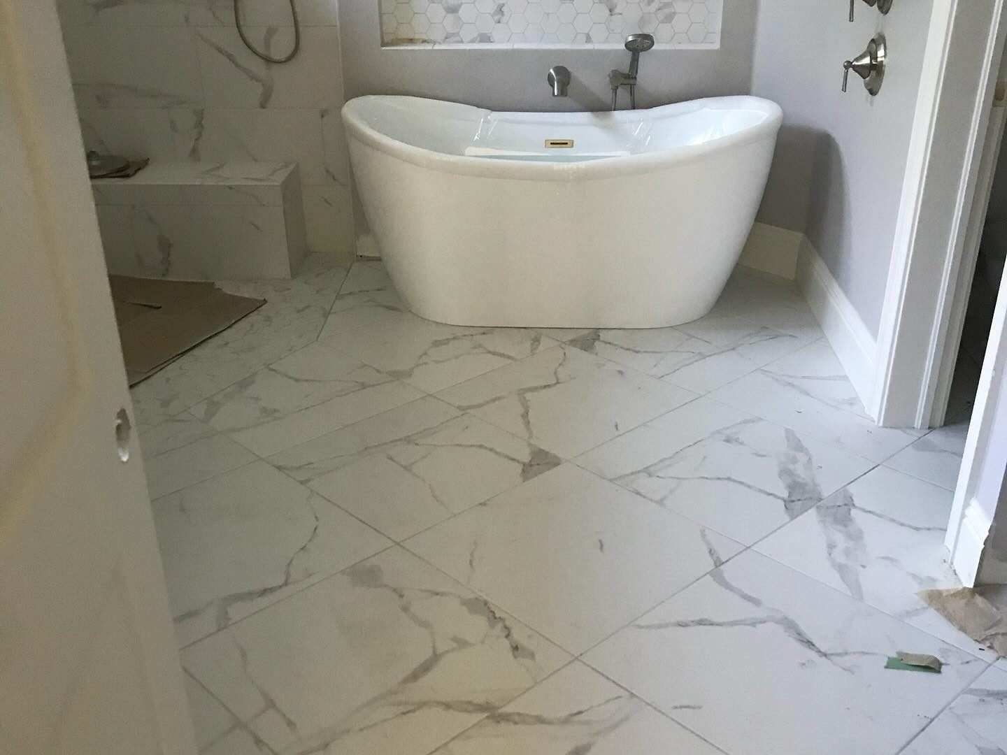 Bathroom gold shower glass door vertical tile Holiday FL