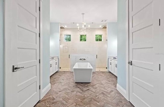 Master bath herringbone floor freestanding tub Holiday FL