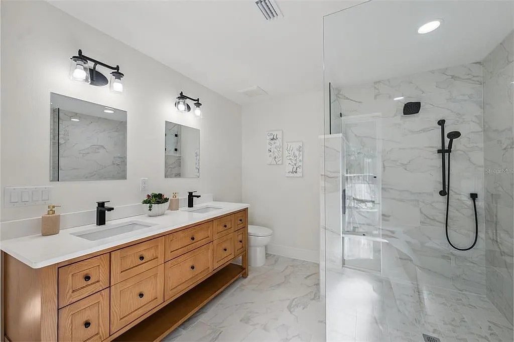 Master bath white vanity freestanding tub Holiday FL