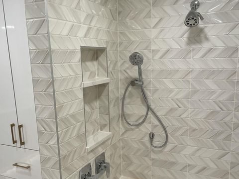 Bathroom shower chevron tile marble bench Holiday FL