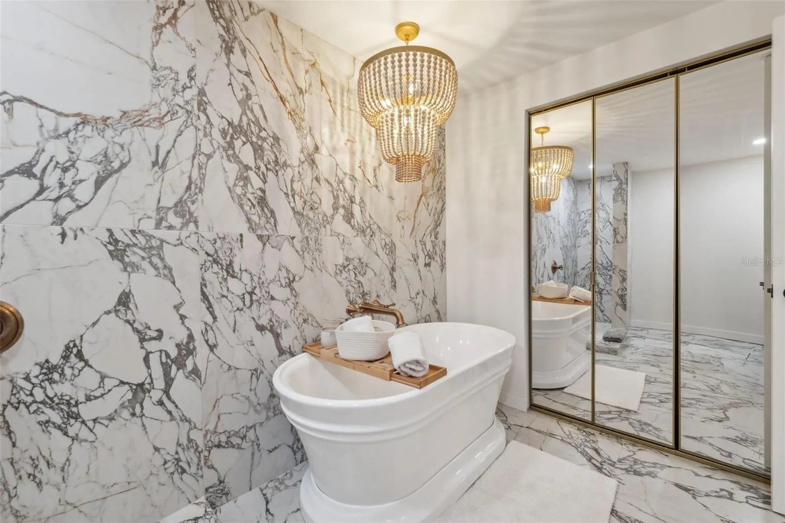 Bathroom wood vanity marble shower tile quartz counter Holiday FL