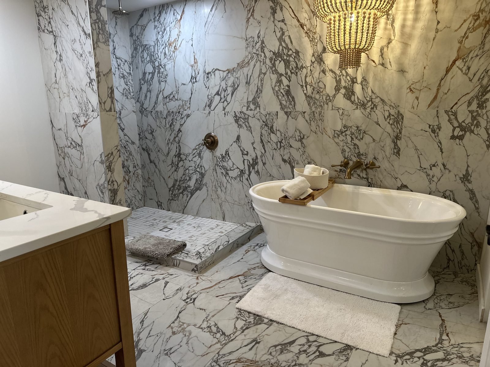 Bathroom wood vanity marble tile freestanding tub Holiday FL