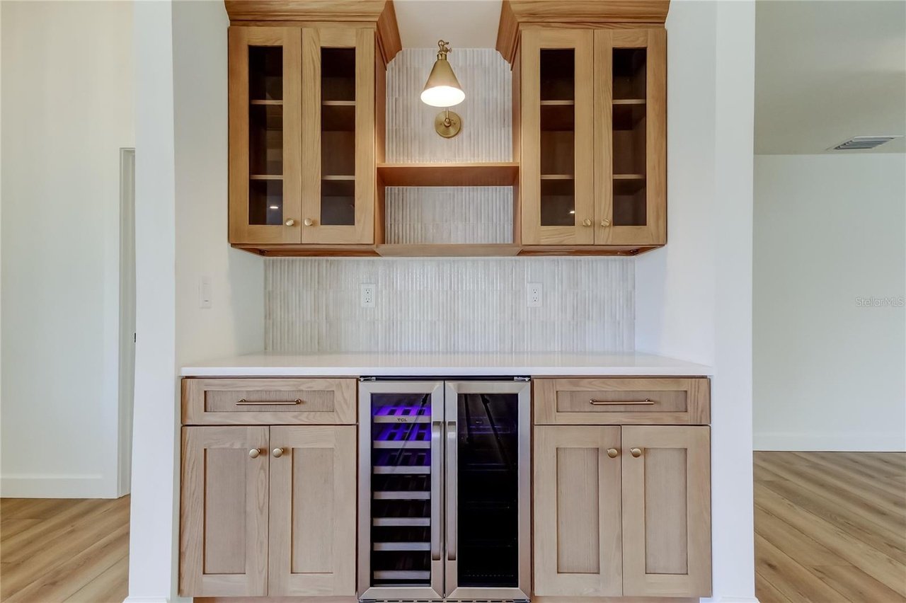 Dry bar wood cabinets glass front wine fridge Holiday FL