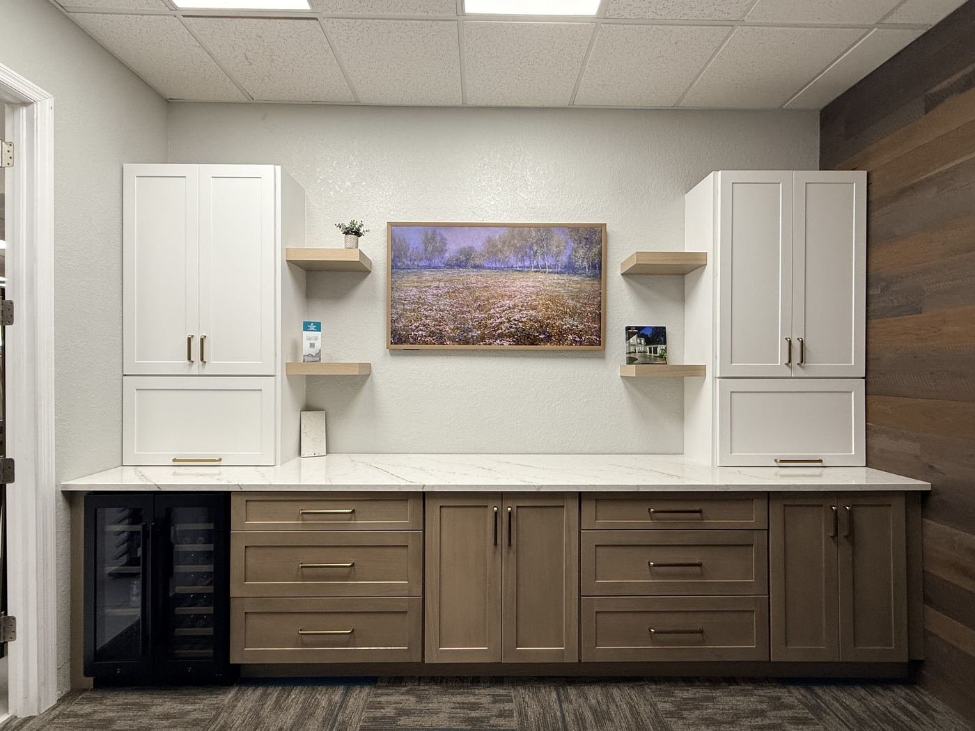 Fabuwood wet bar display with white and wood-tone cabinets and quartz countertop in Carpet Corner Kitchen & Bath showroom, Holiday FL