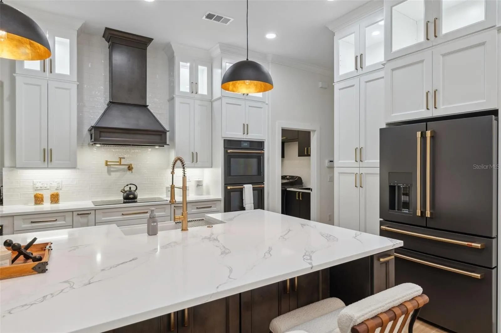 Two-tone kitchen quartz island cafe appliances Holiday FL