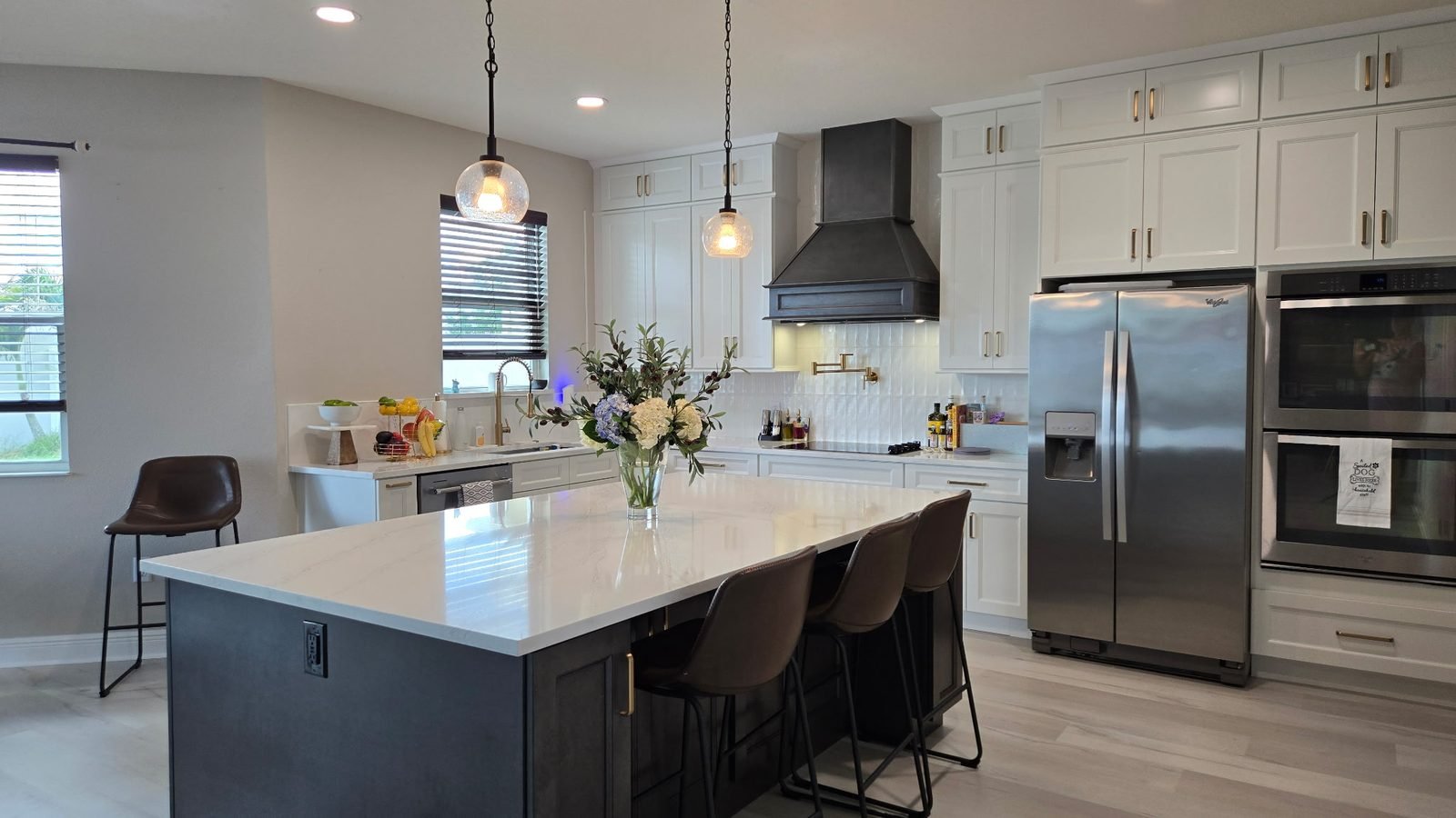 White kitchen with black island Holiday FL