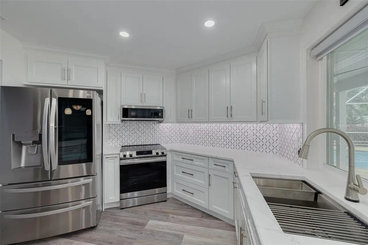 White kitchen geometric tile backsplash Holiday FL