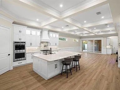 White kitchen wood island open shelves Holiday FL