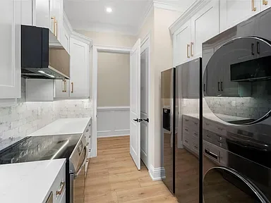 White kitchen black appliances Holiday FL