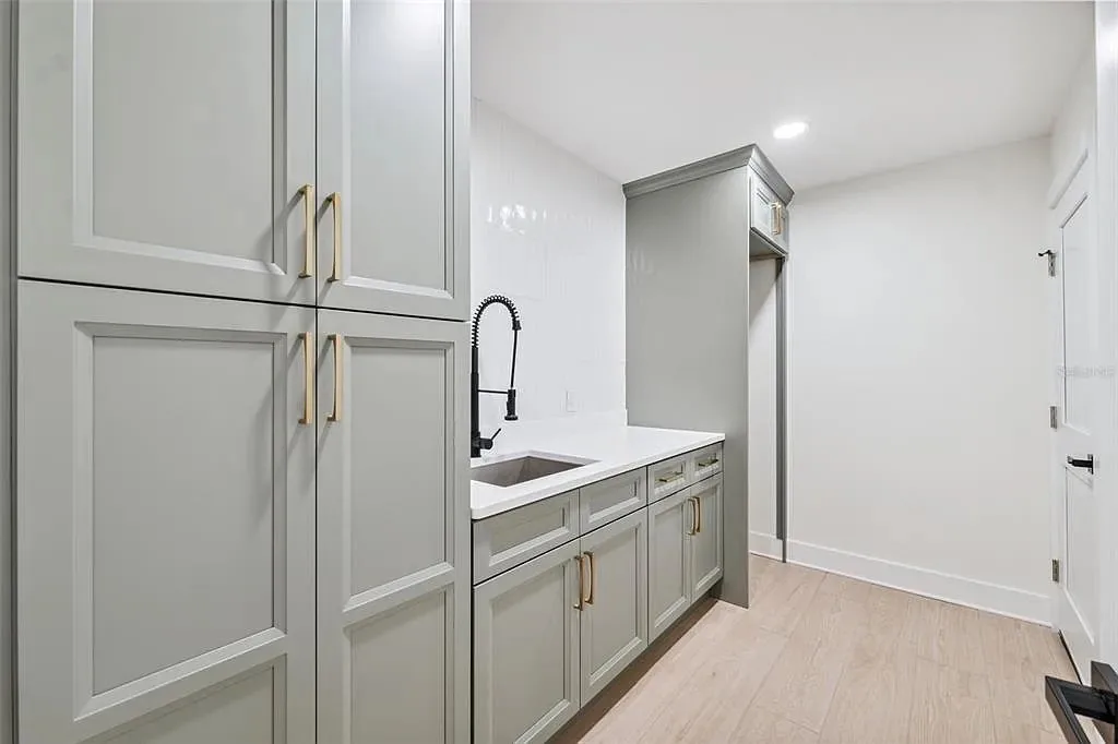 Laundry room gray cabinets sink Holiday FL