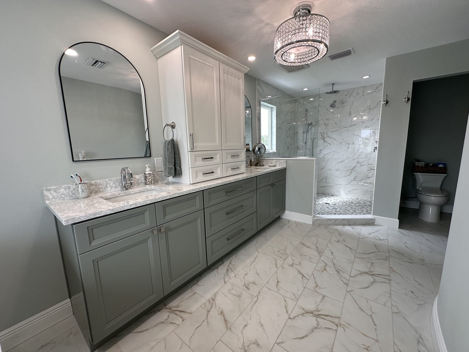 Master bath green and white double vanity double sink chandelier Holiday FL
