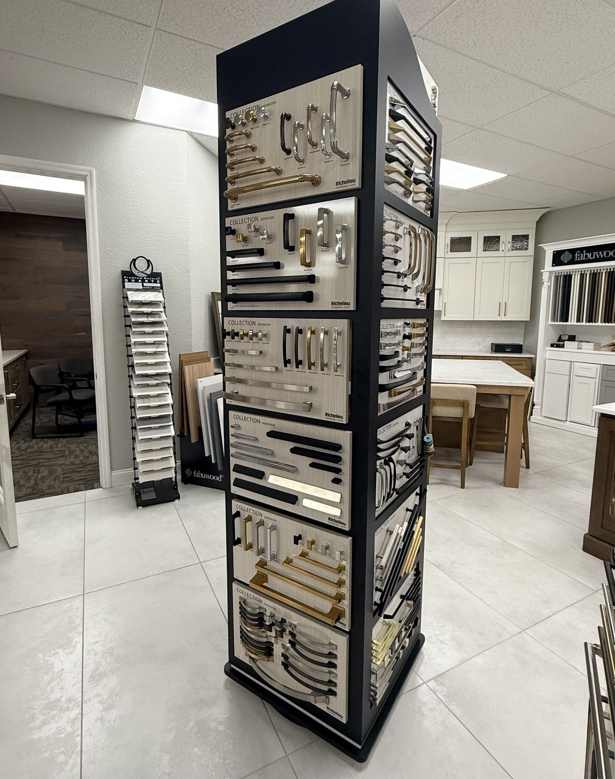 Richelieu cabinet hardware display with pulls and knobs in Carpet Corner Kitchen and Bath showroom, Holiday FL