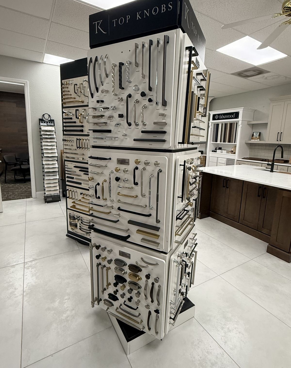 Top Knobs cabinet hardware display wall with knobs and pulls in Carpet Corner Kitchen and Bath showroom, Holiday FL