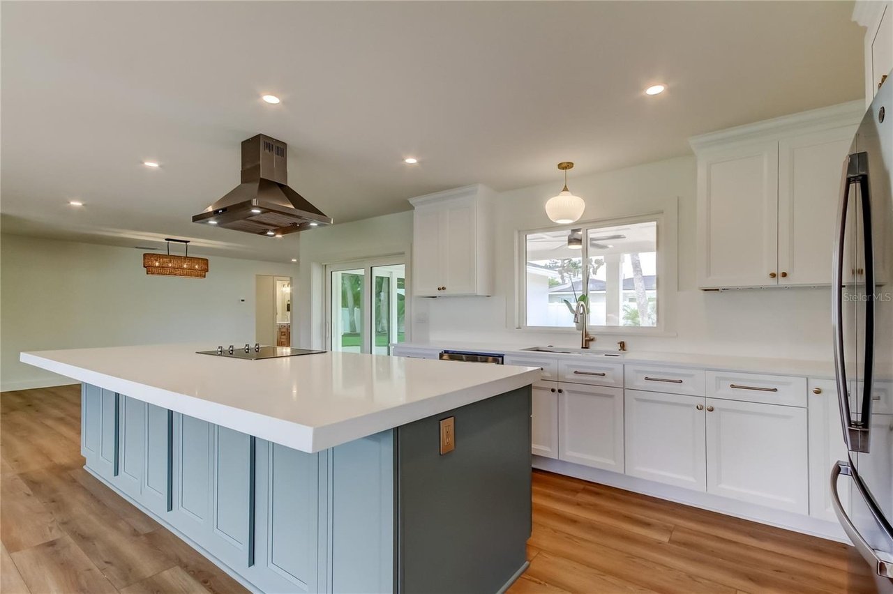 Two-tone kitchen blue island white cabinets quartz countertop Holiday FL