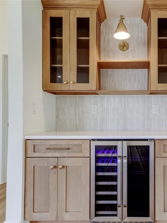 Custom wet bar natural wood cabinets wine fridge Holiday FL